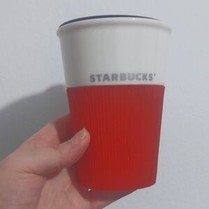 White Starbucks Travel Mug with Red Silicone Grip Cozy and Black Lid